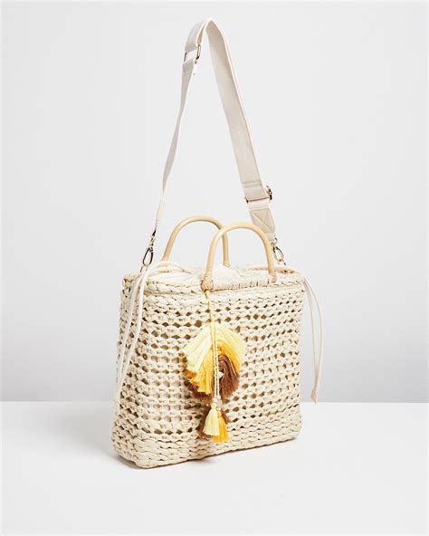 oliver bonas straw bag.